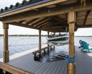 A wooden dock in Orlando with a newly installed Boat Lift on it.