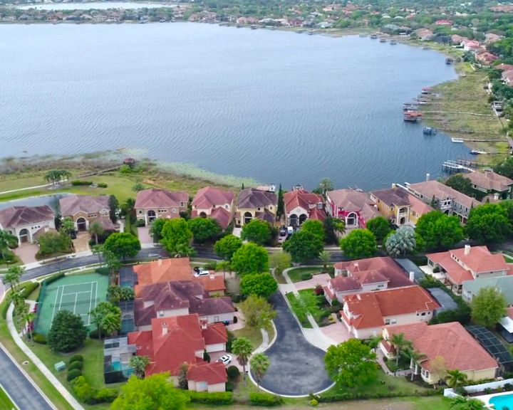 Aerial view of houses in lakefront residential area in Doctor Phillips, Orlando FL.