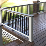A wooden deck with a railing and railing.