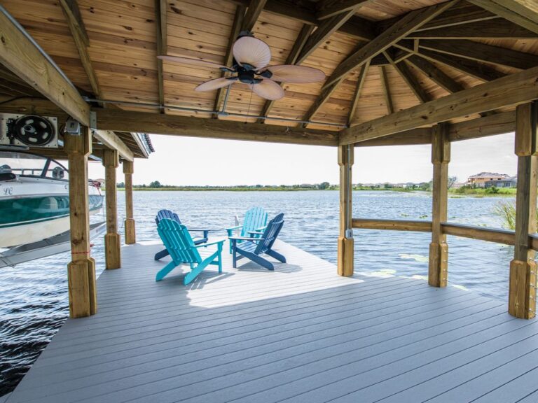 A dock with chairs and a boat in the water, located in Orlando.